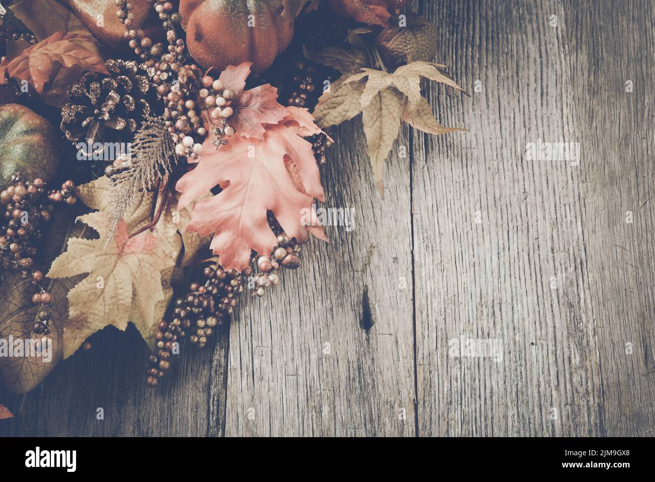 Autumn Leaves on Rustic Wood Background with Instagram Style Filter ...