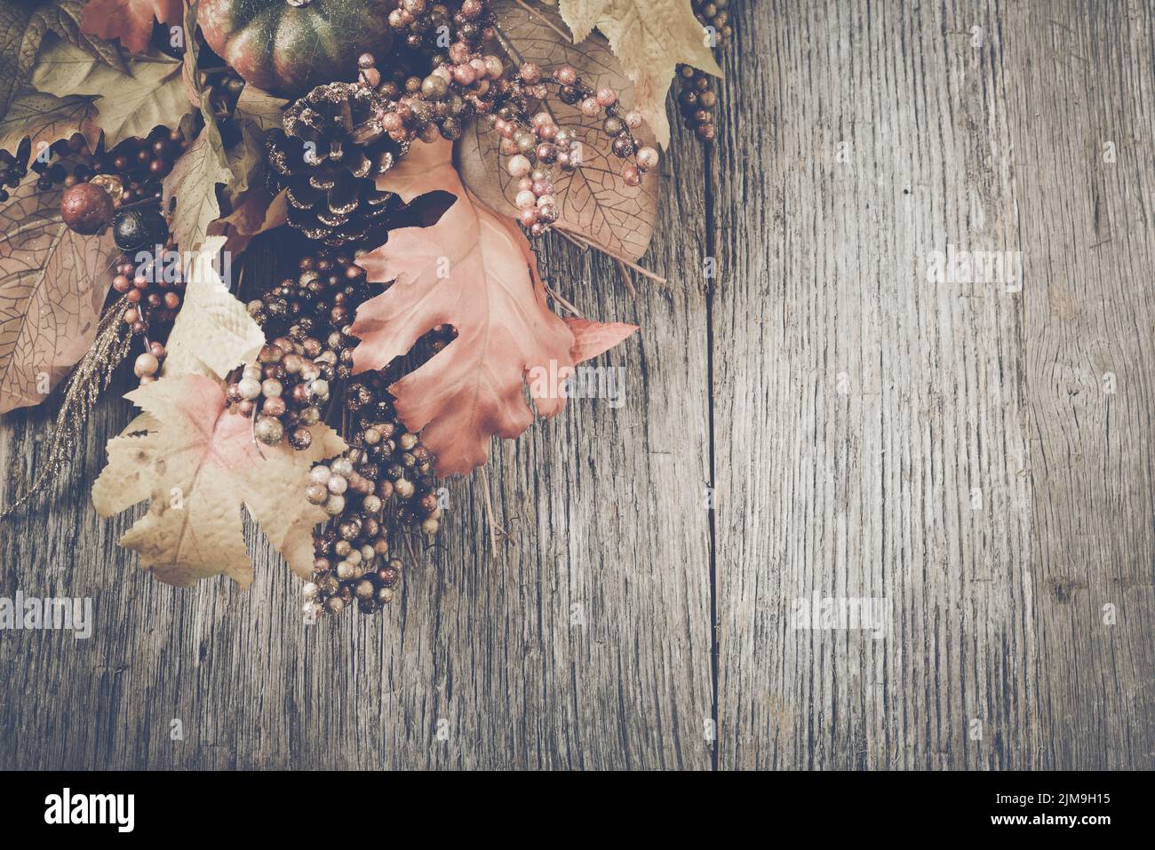 Autumn Leaves on Rustic Wood Background with Instagram Style Filter ...