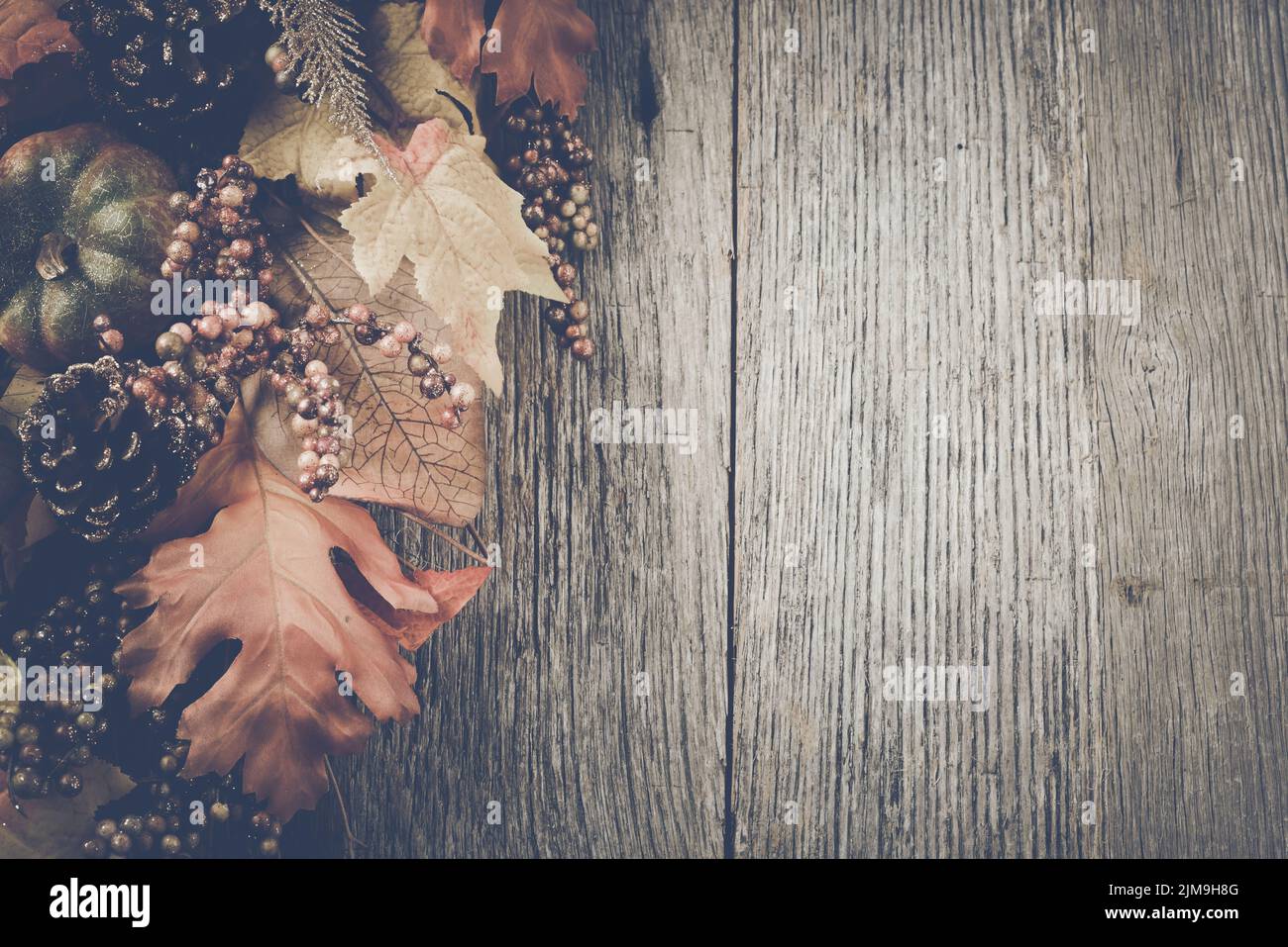 Autumn Leaves on Rustic Wood Background with Instagram Style Filter ...