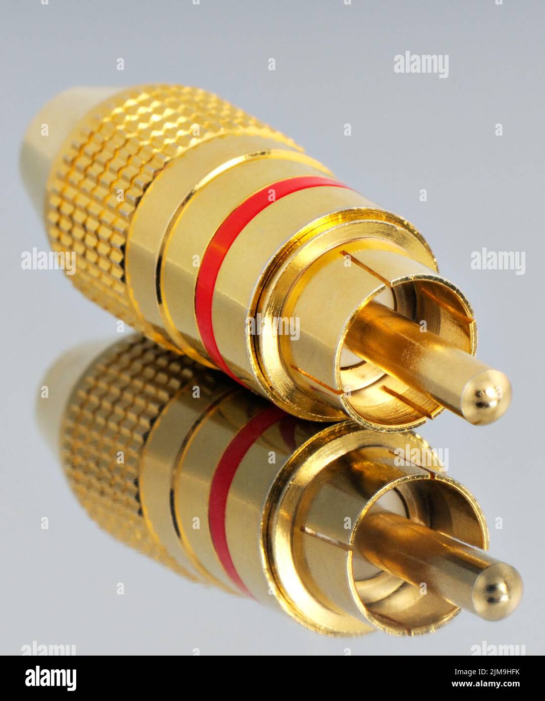 Audio connector on reflective surface Stock Photo Alamy