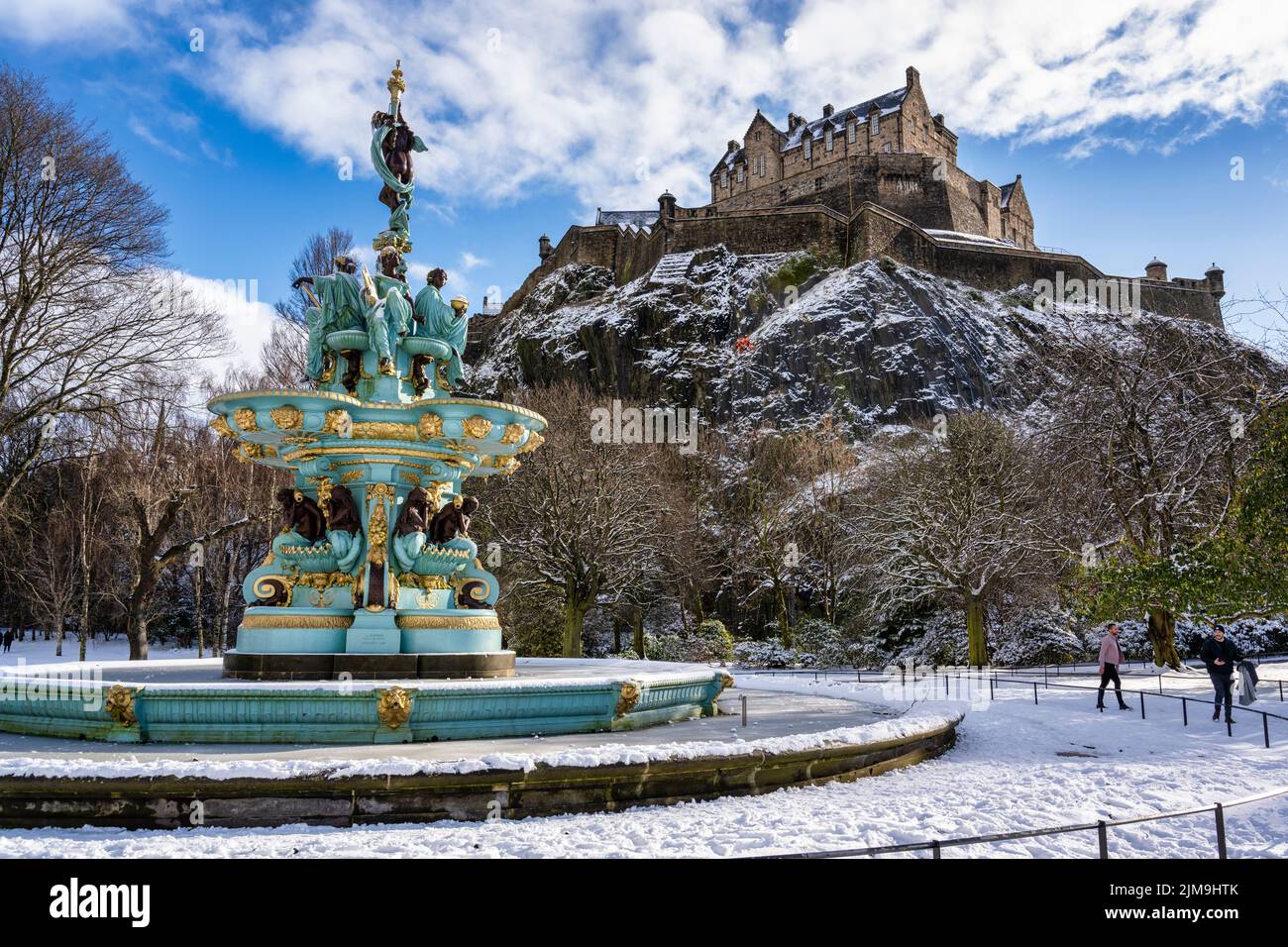 Frozen Ross Fountain with a covering of snow with Edinburgh Castle in background viewed from West Princes Street Gardens in Edinburgh, Scotland, UK Stock Photo