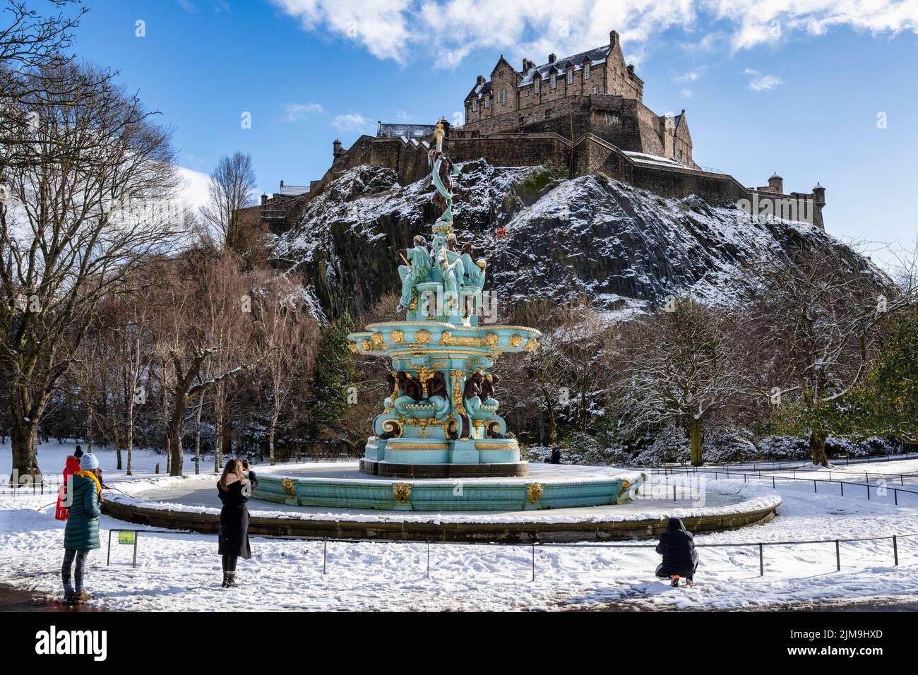 Frozen Ross Fountain with a covering of snow with Edinburgh Castle in background viewed from West Princes Street Gardens in Edinburgh, Scotland, UK Stock Photo