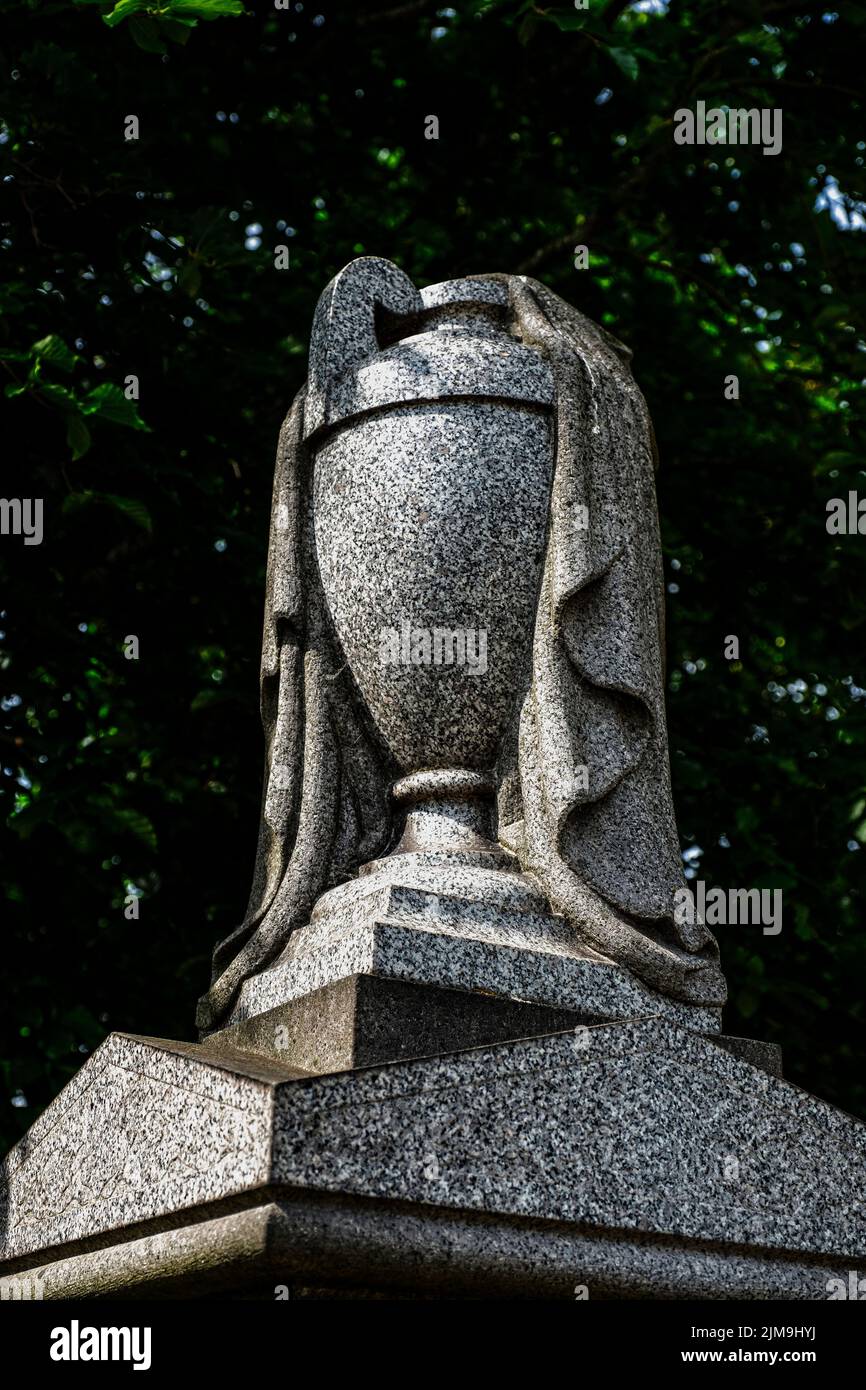 Urn on grave in cemetery UK Stock Photo