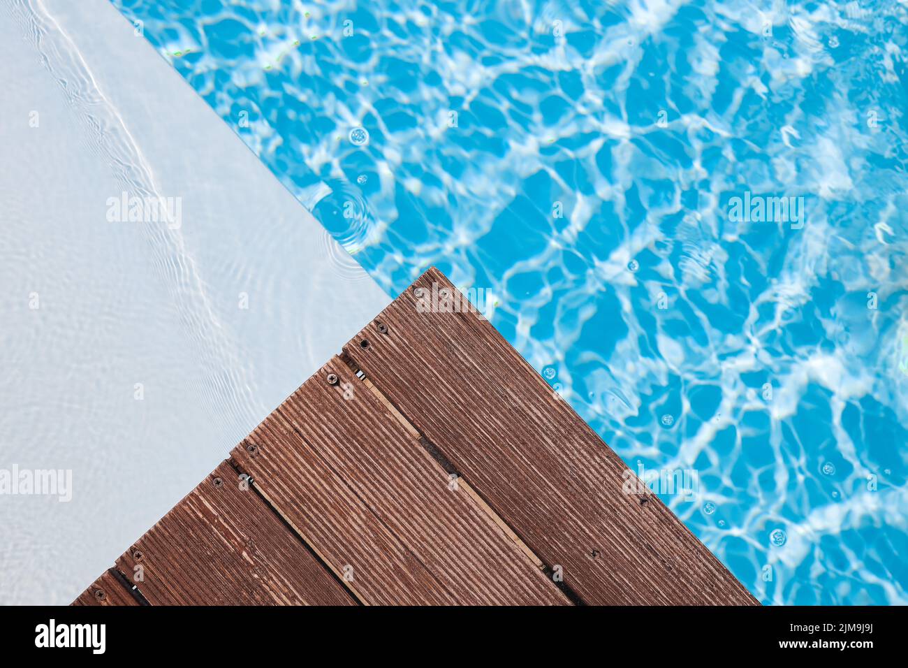 Wooden platform on swimming pool background. Pool background wallpaper ...