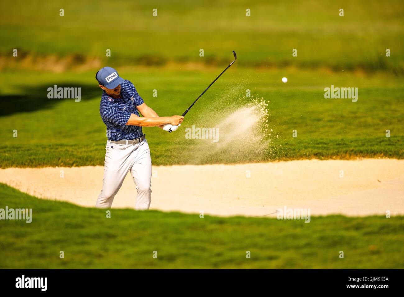 Greensboro, NC. August 4, 2022 Austin Cook hits out of the bunker on