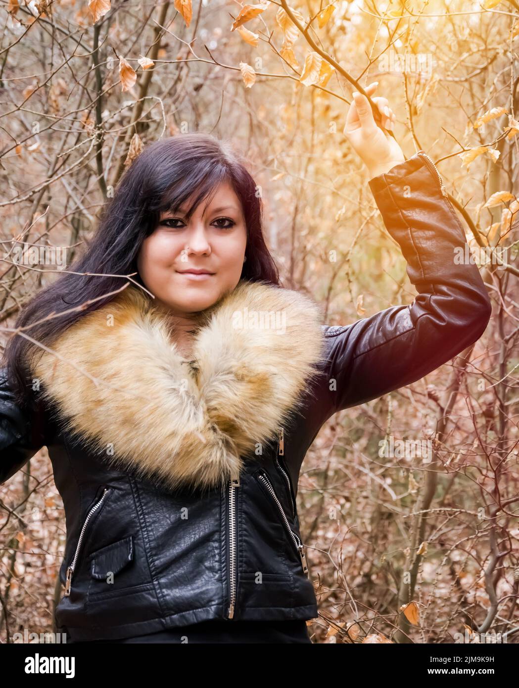 Young woman with fur jacket Stock Photo