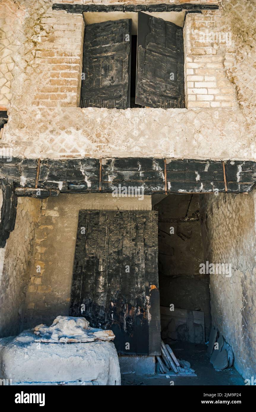 Original door and windows in the Herculaneum excavation, Naples, Italy Stock Photo