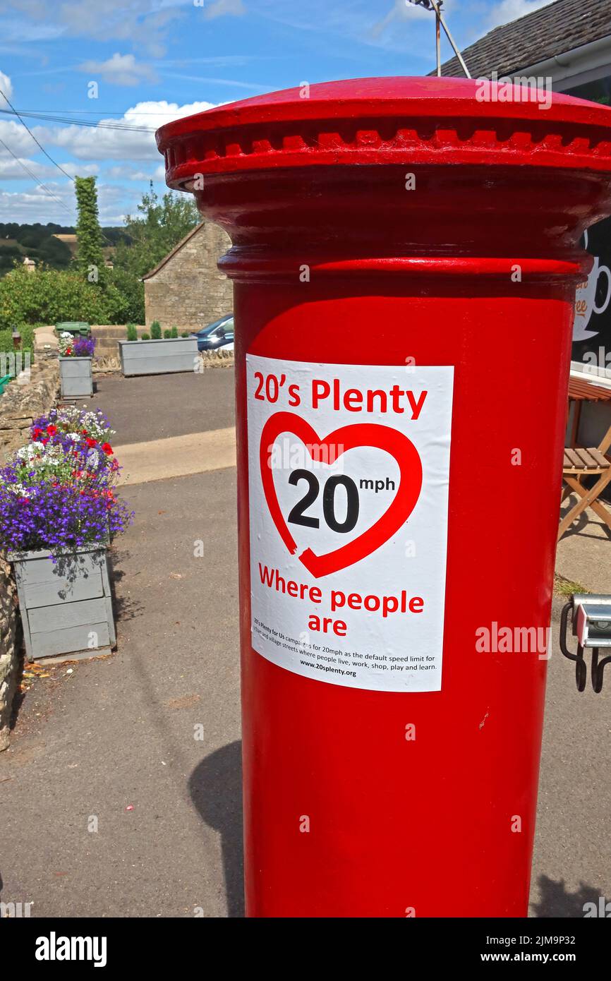 20s plenty, Where People Are, slow down, sign, on postbox, Eastcombe village, Stroud, Gloucestershire, England, UK, GL6 7EB Stock Photo