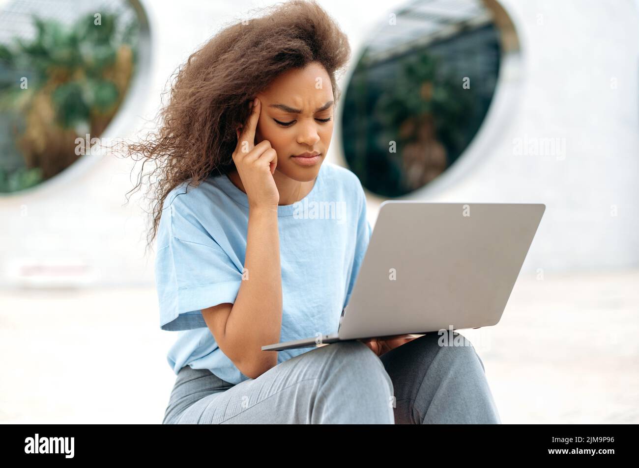 Stressed tired african american young business woman, freelancer ...
