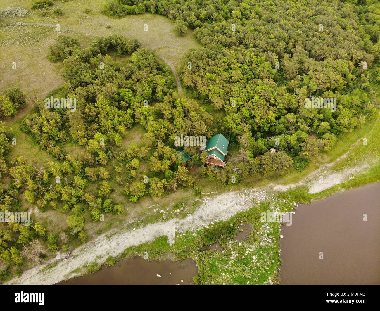 An aerial view of little rural house in the forest Stock Photo - Alamy