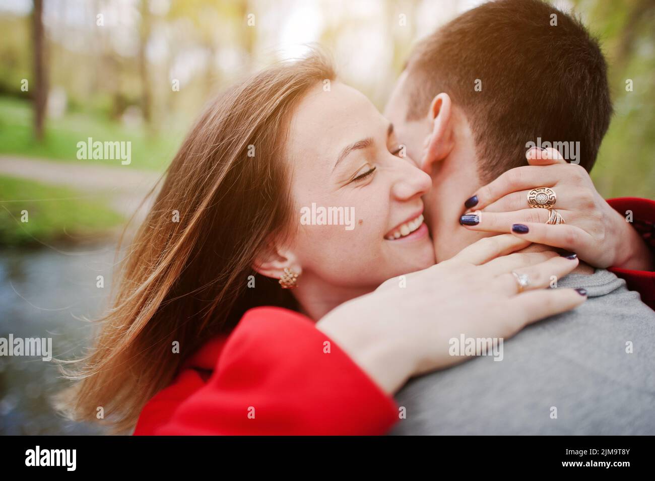 Sincere emotions and hugs of couple in love, close up. Stock Photo