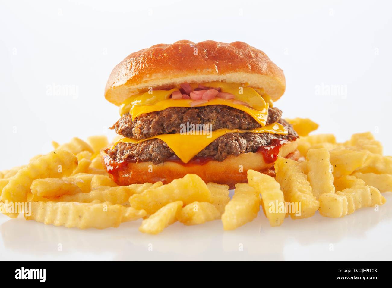 Brioche donut double decker beef cheese burger with queso sauce. Stock Photo