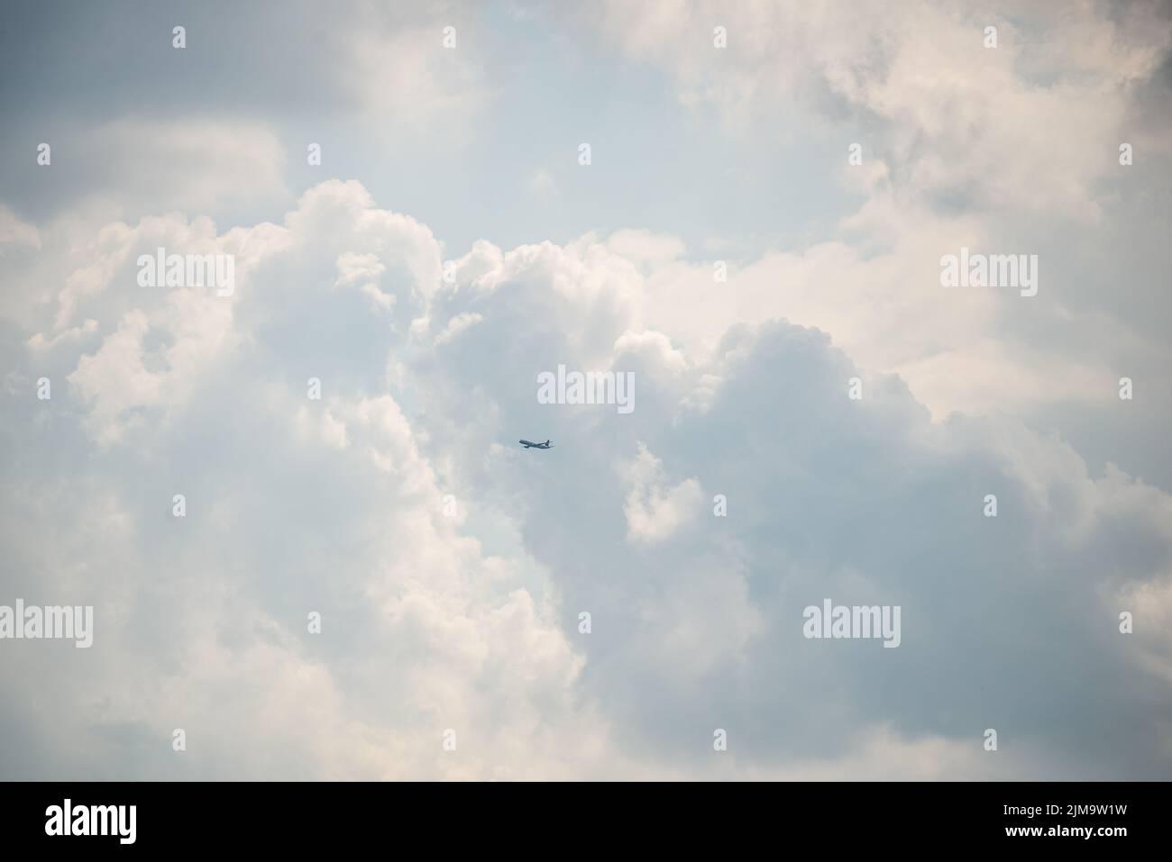 A low angle shot of the blue cloudy sky with the sunlight Stock Photo ...