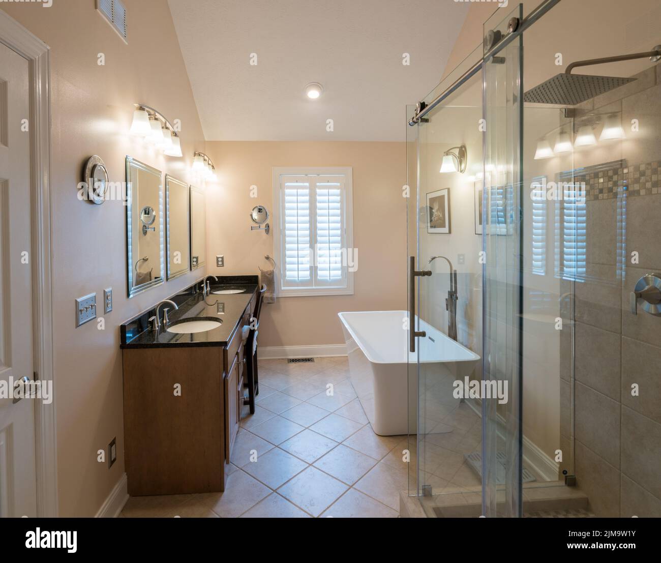 Modern bathroom with freestanding tub and vanity Stock Photo