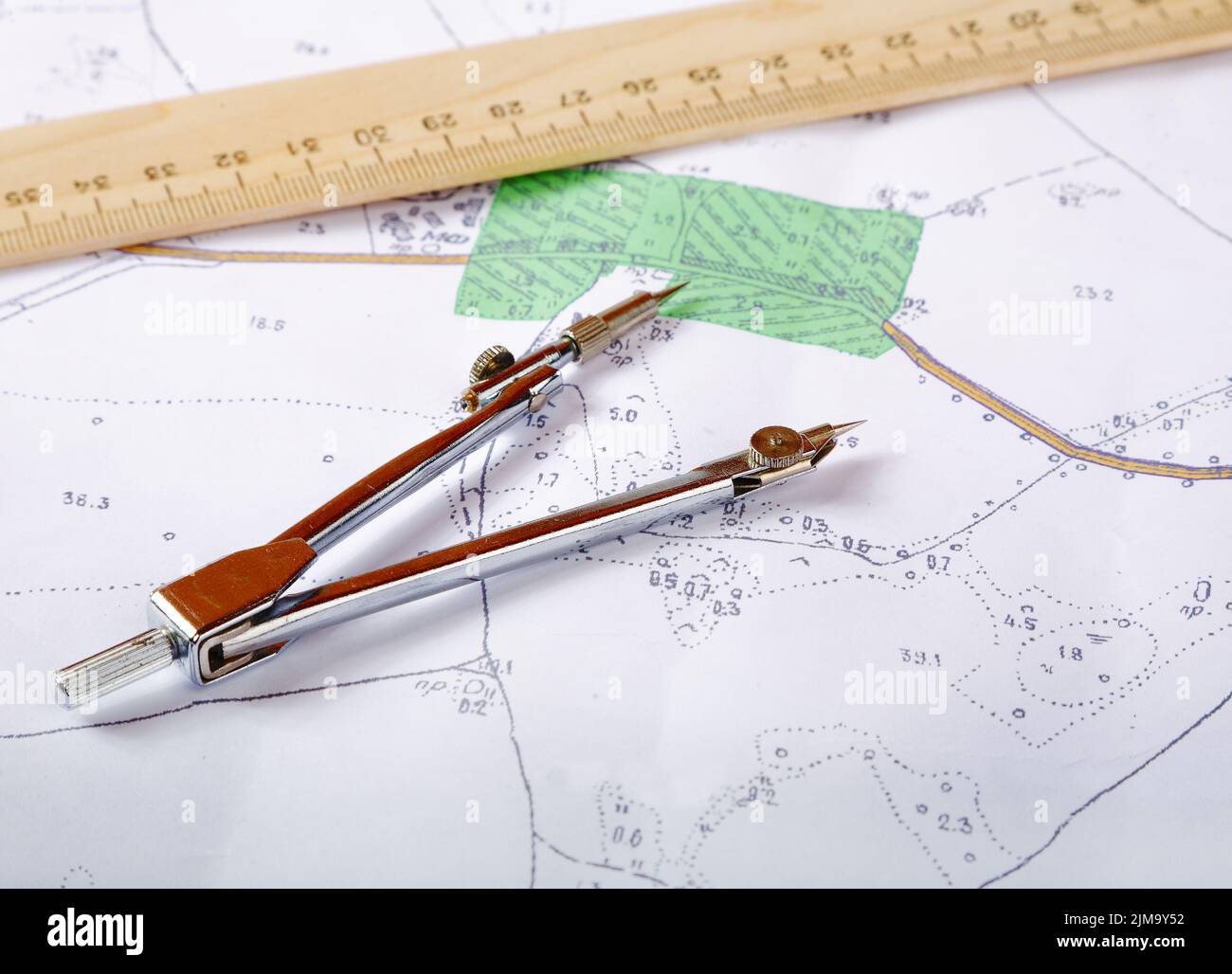 Topographic map of district with measuring instrument and ruler Stock