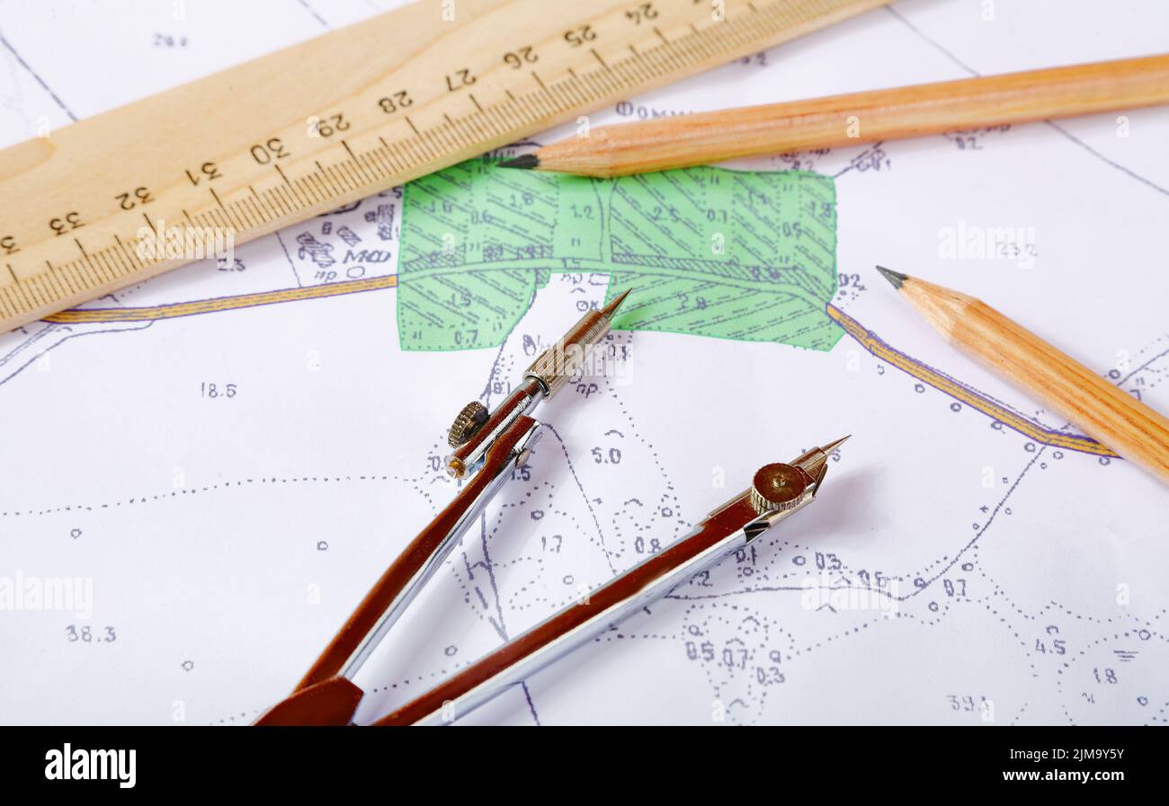Topographic map of district with measuring instrument and ruler Stock Photo Alamy