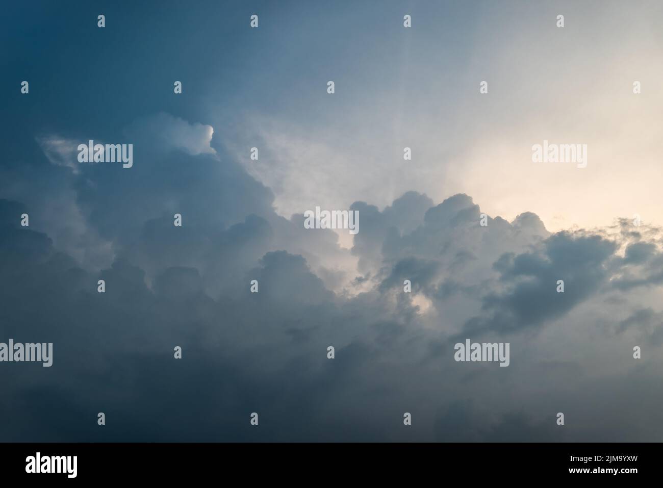 Cumulus clouds in the sky before sunset Stock Photo