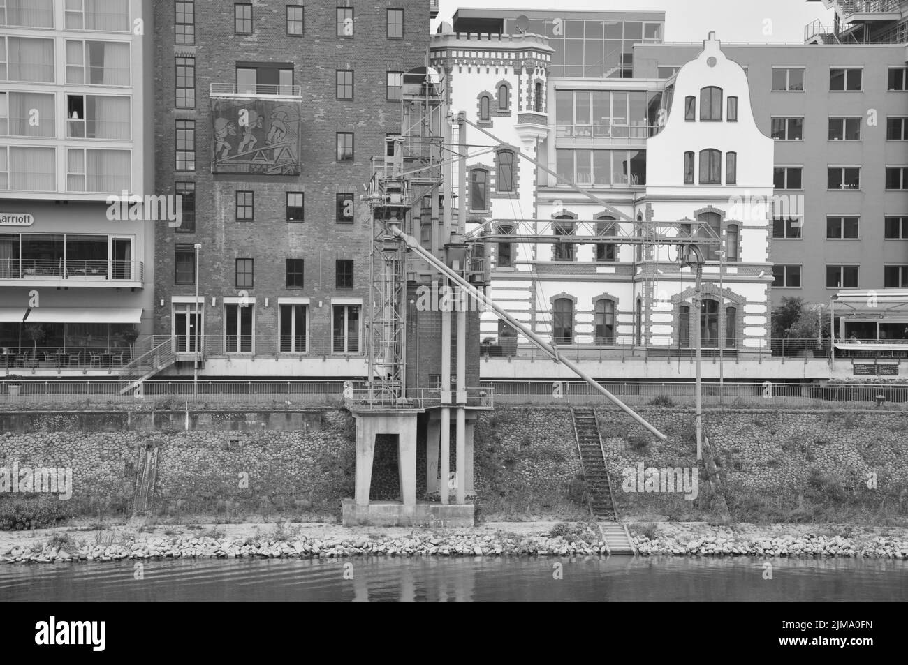 A grayscale shot of the old bottling plant in the Media Harbor in Dusseldorf, Germany. Stock Photo