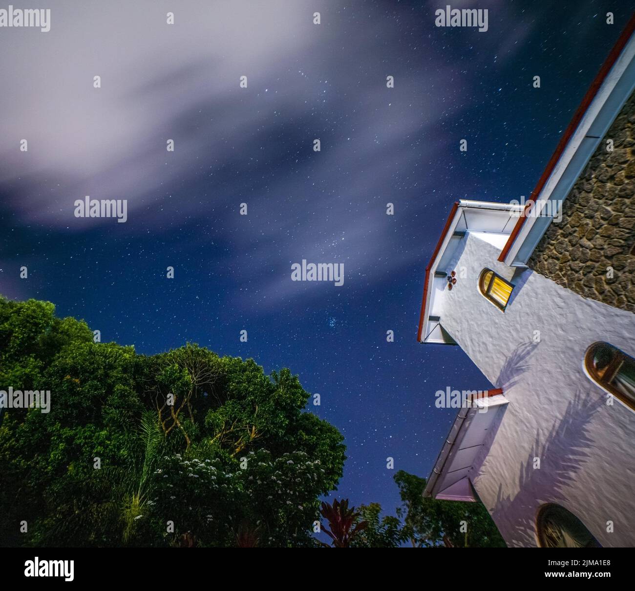 A long exposure of starry night with clouds Stock Photo - Alamy