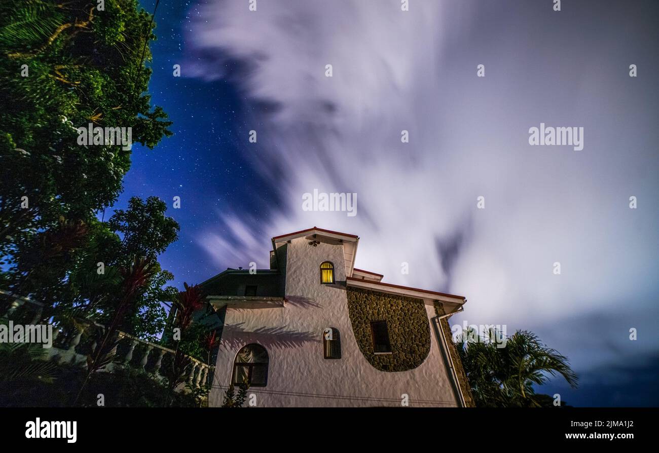The long exposure of starry night with clouds Stock Photo - Alamy