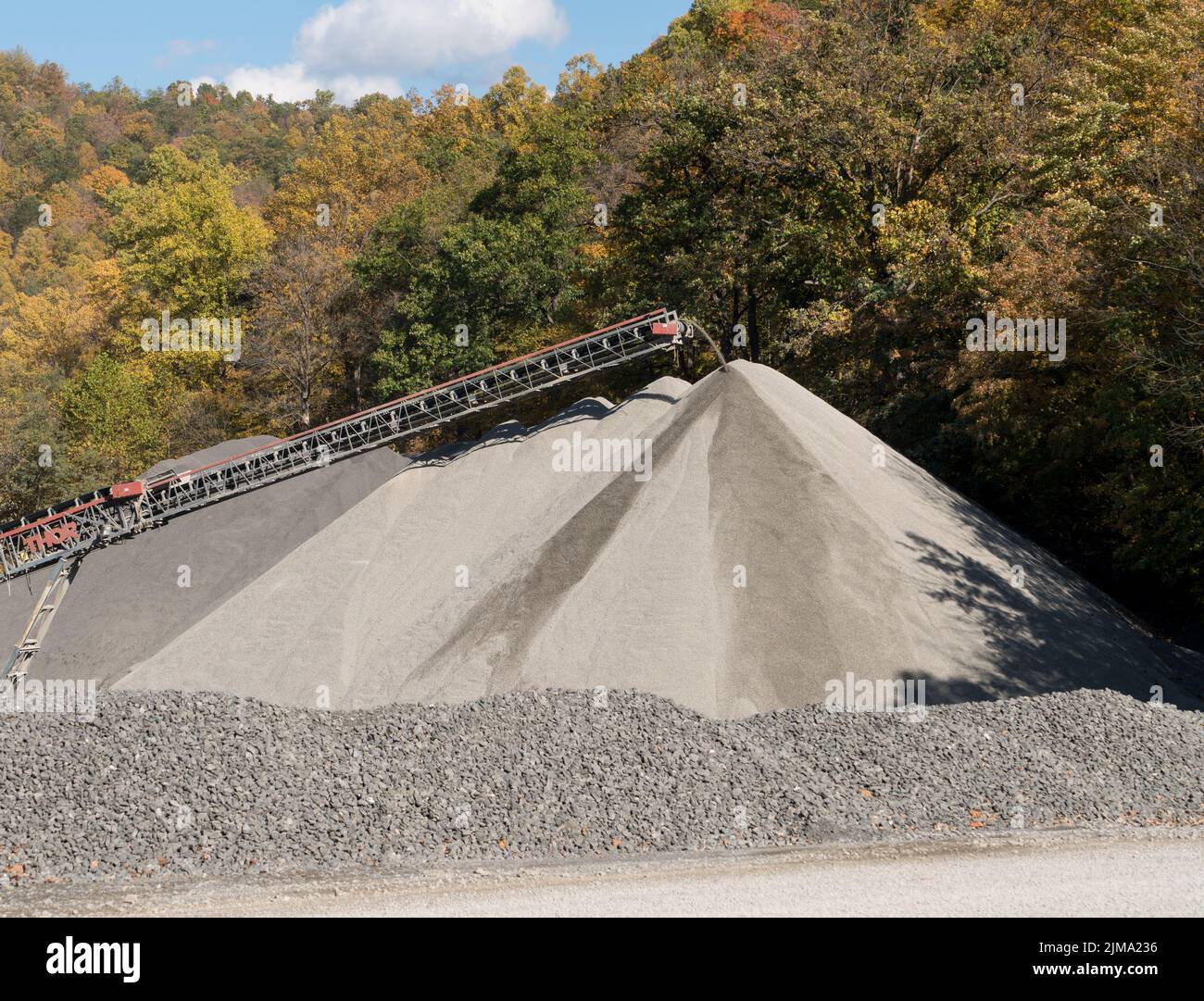 Limestone or crushed stone factory in wooded valley Stock Photo