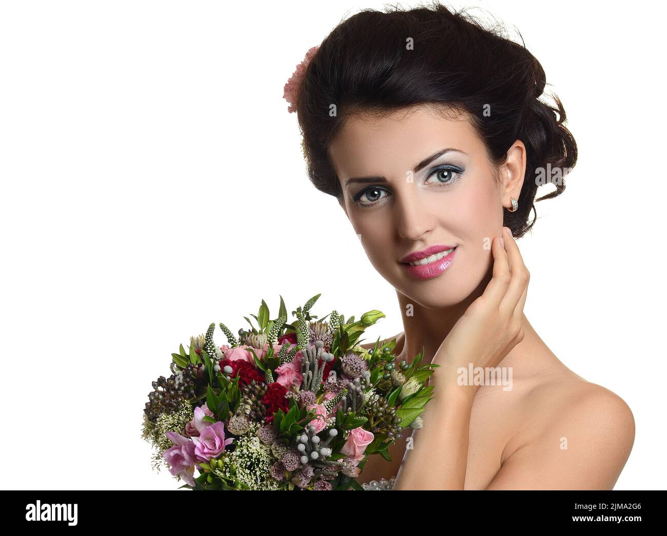 Studio portrait of a young beautiful bride with a wedding bouquet Stock ...