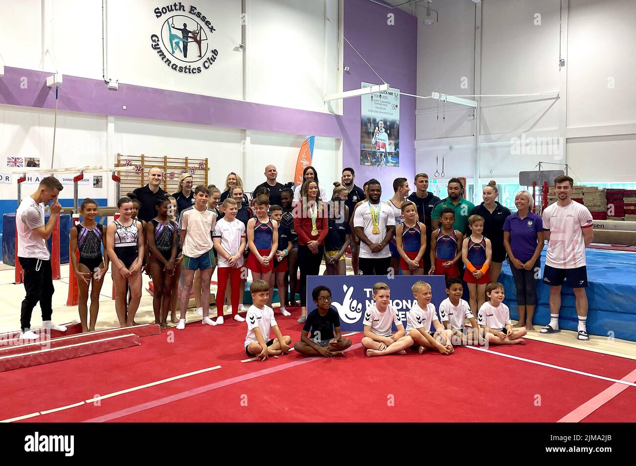 Max Whitlock (left), Georgia-Mae Fenton (centre) and Courtney Tulloch poses for photographers at the South Essex Gymnastics Club, Essex. Picture date: Friday August 5, 2022. Max Whitlock, Courtney Tulloch and Georgia-Mae Fenton surprised a room full of young children who have been supporting Team England throughout the Games. Stock Photo