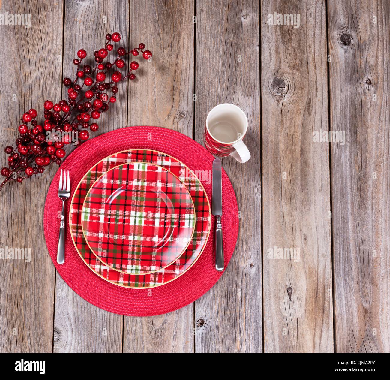 Xmas dinner setting for the festive holiday season on rustic wood Stock Photo