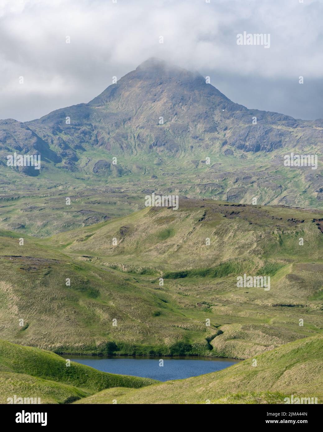 Mount Reed rises from Adak's rugged landscape Stock Photo - Alamy