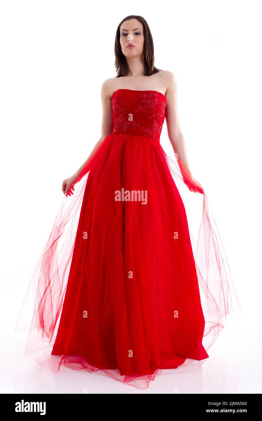 Beautiful woman in a red dress posing for a photo shoot Stock Photo - Alamy