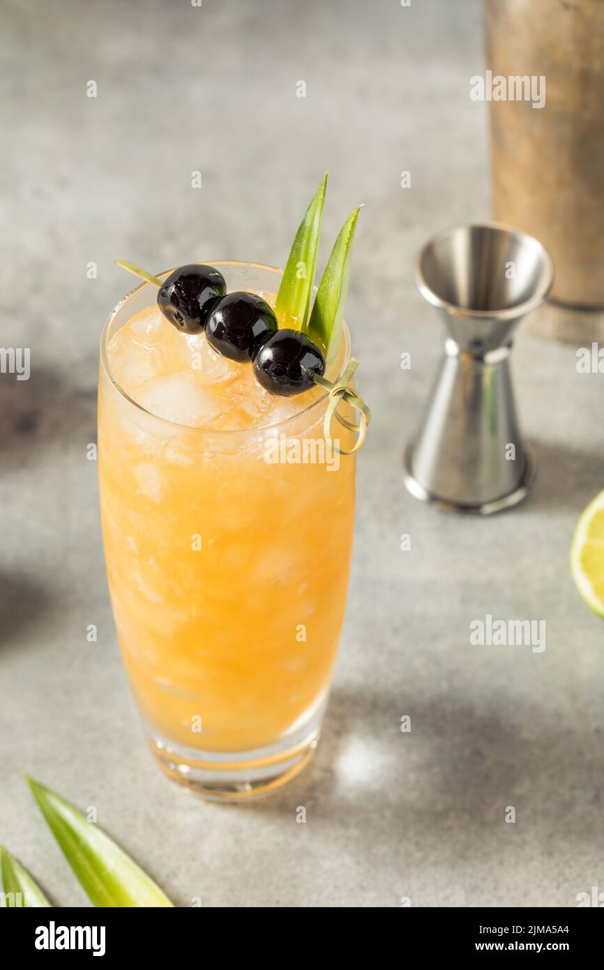 Cold refreshing three dots and a dash cocktail with rum and pineapple
