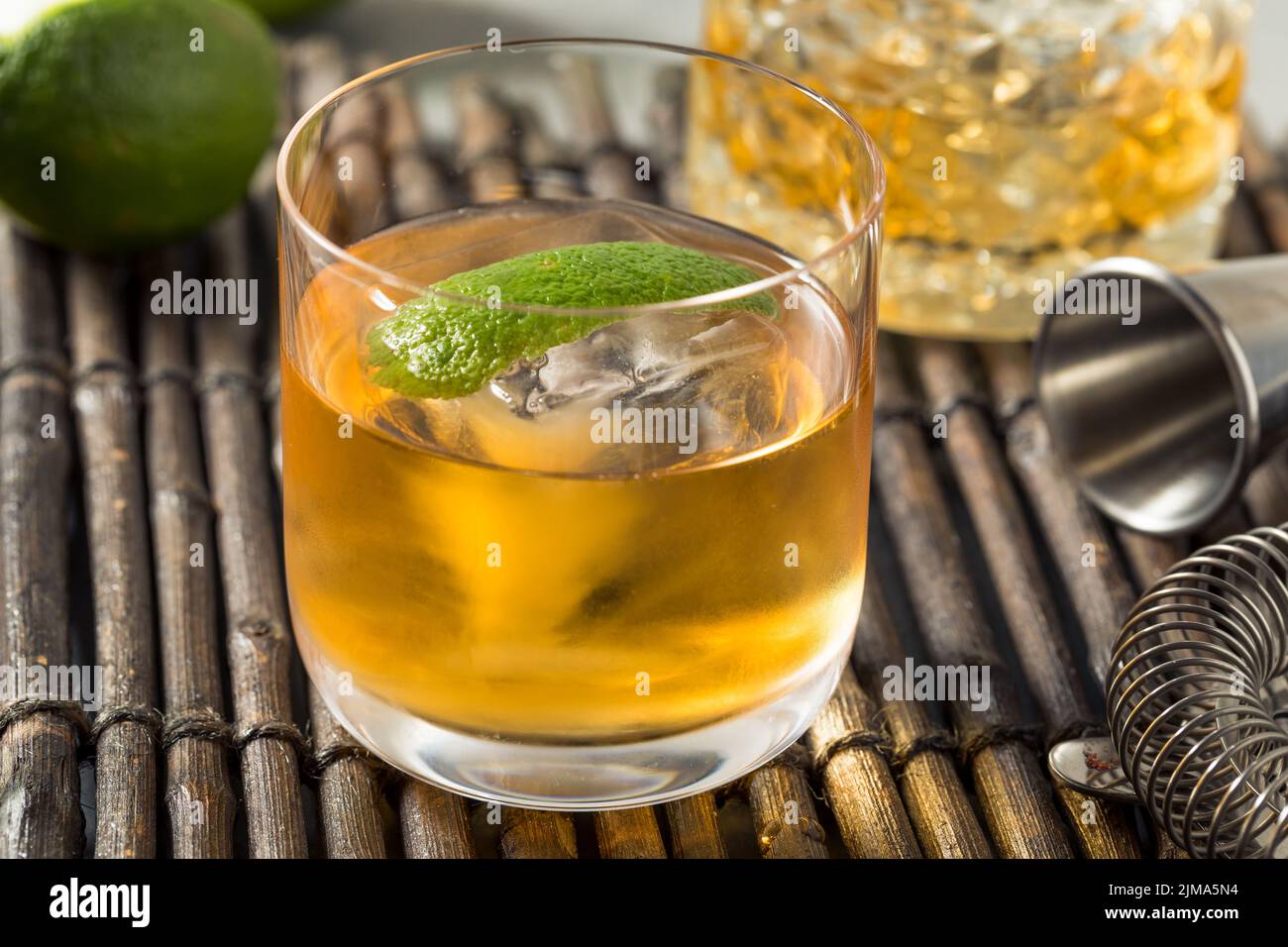 Boozy Cold Rum Old Fashioned with Lime and an Ice Cube Stock Photo