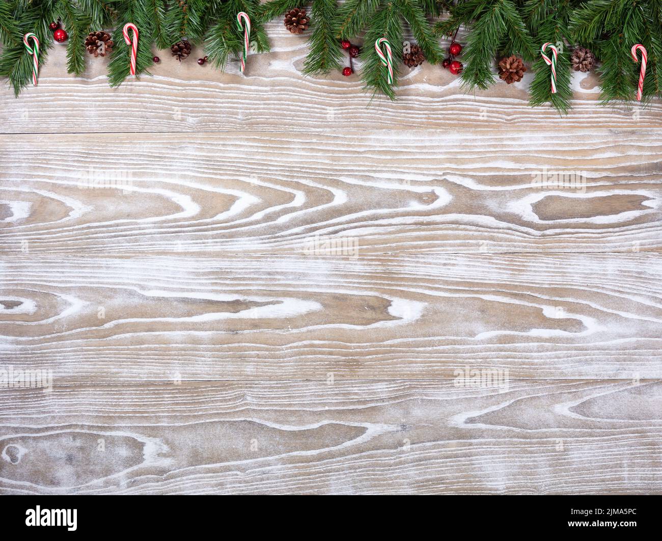 Rustic white wooden boards with fir branches for Christmas season concept Stock Photo