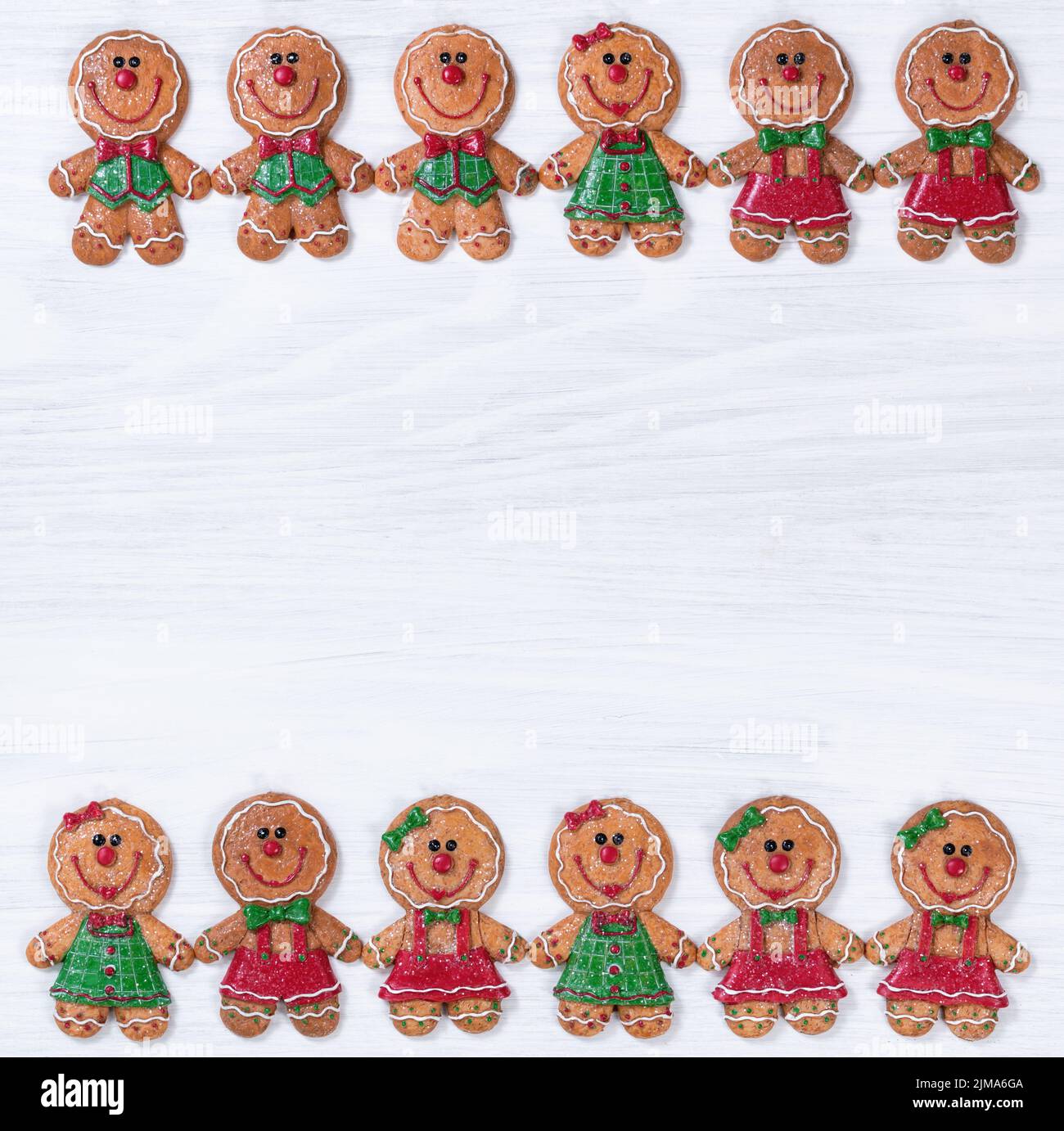 White wooden boards with Christmas cookies on upper and lower borders Stock Photo