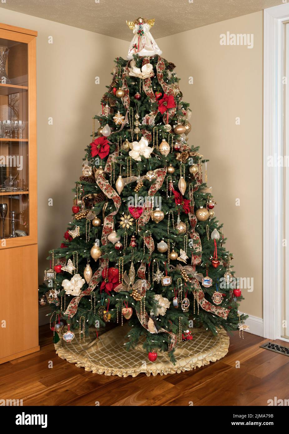 Decorated christmas tree in modern living room Stock Photo