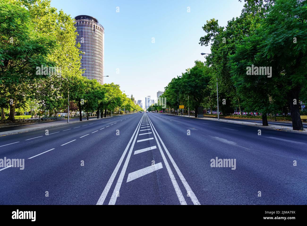 Great avenue of the Paseo de la Castellana, in the city of Madrid, with little traffic on a public holiday. Stock Photo