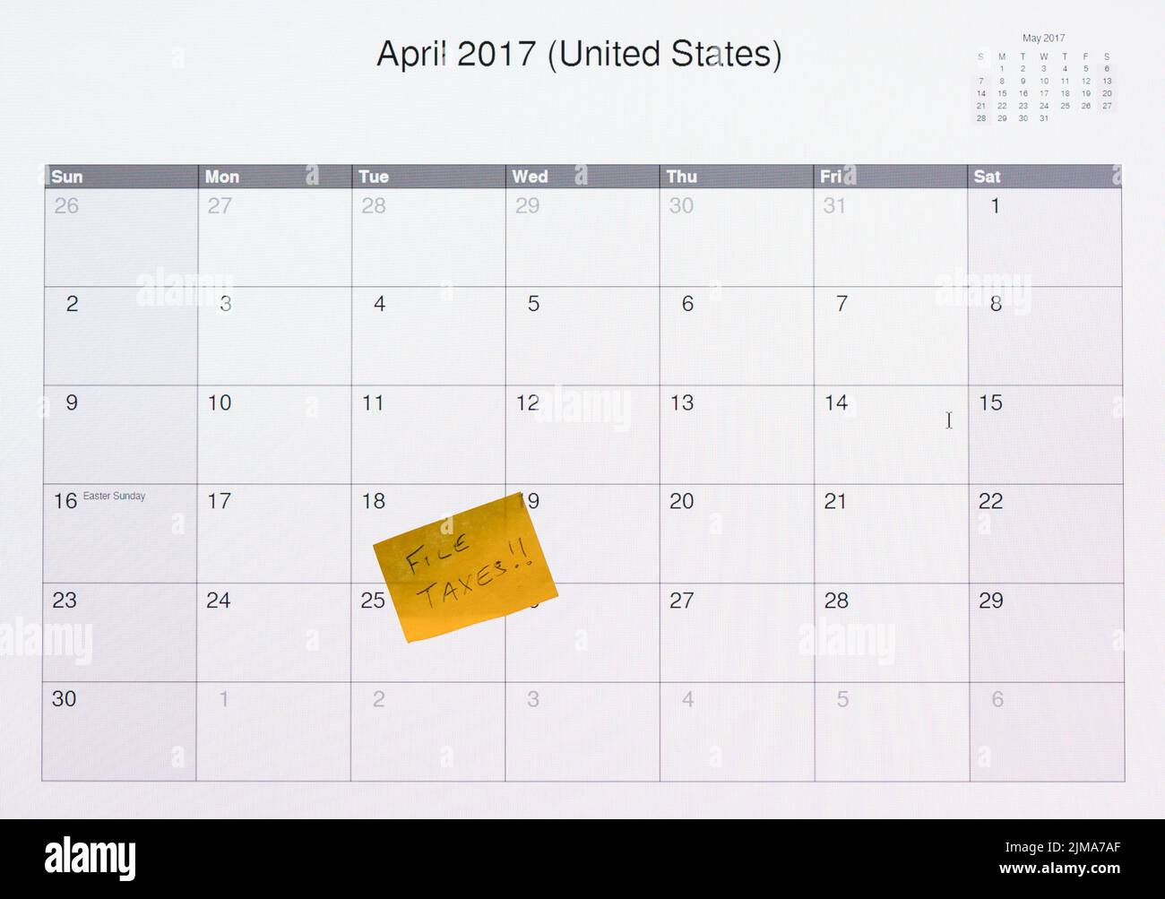 Computer monitor calendar for tax filing day 2017 Stock Photo