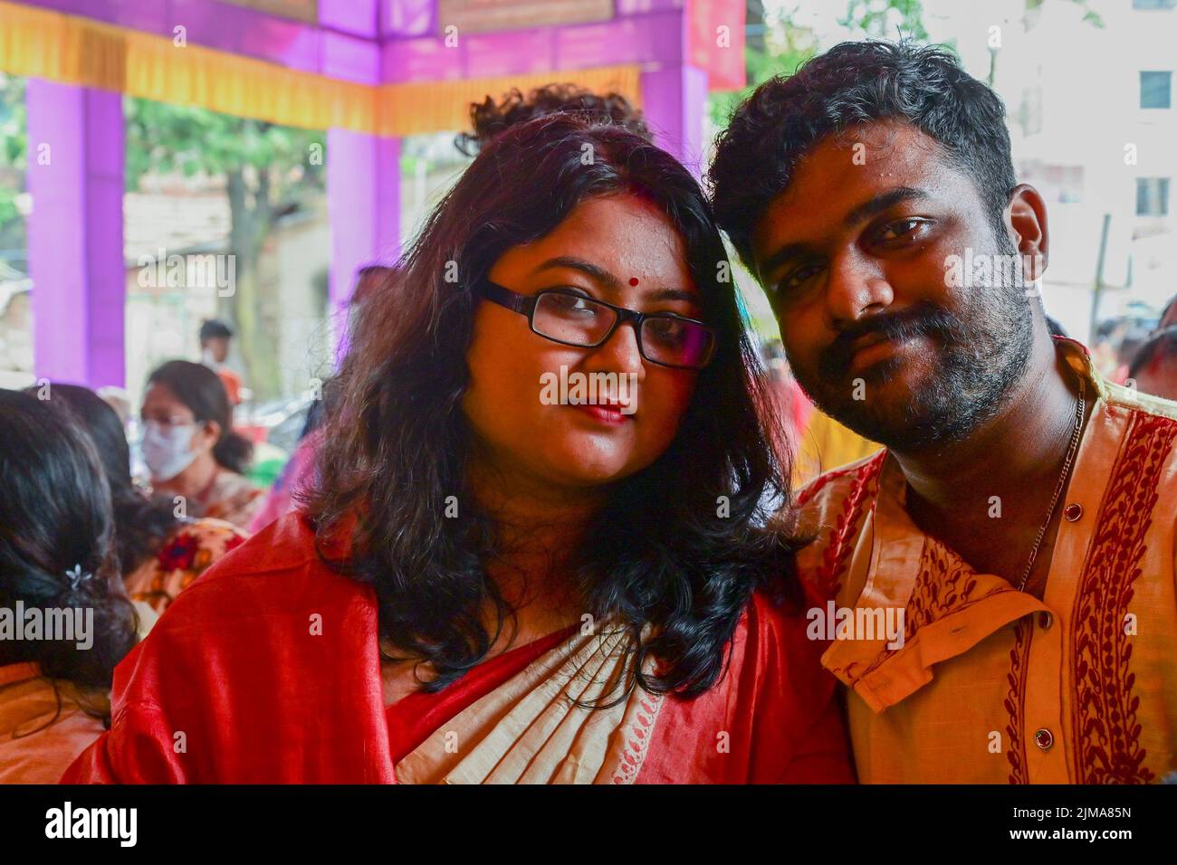 Howrah, West Bengal, India - 14th October 2021 : Newly married romantic couple posing for camera inside Durga Puja pandal. Durga Puja festival. Stock Photo