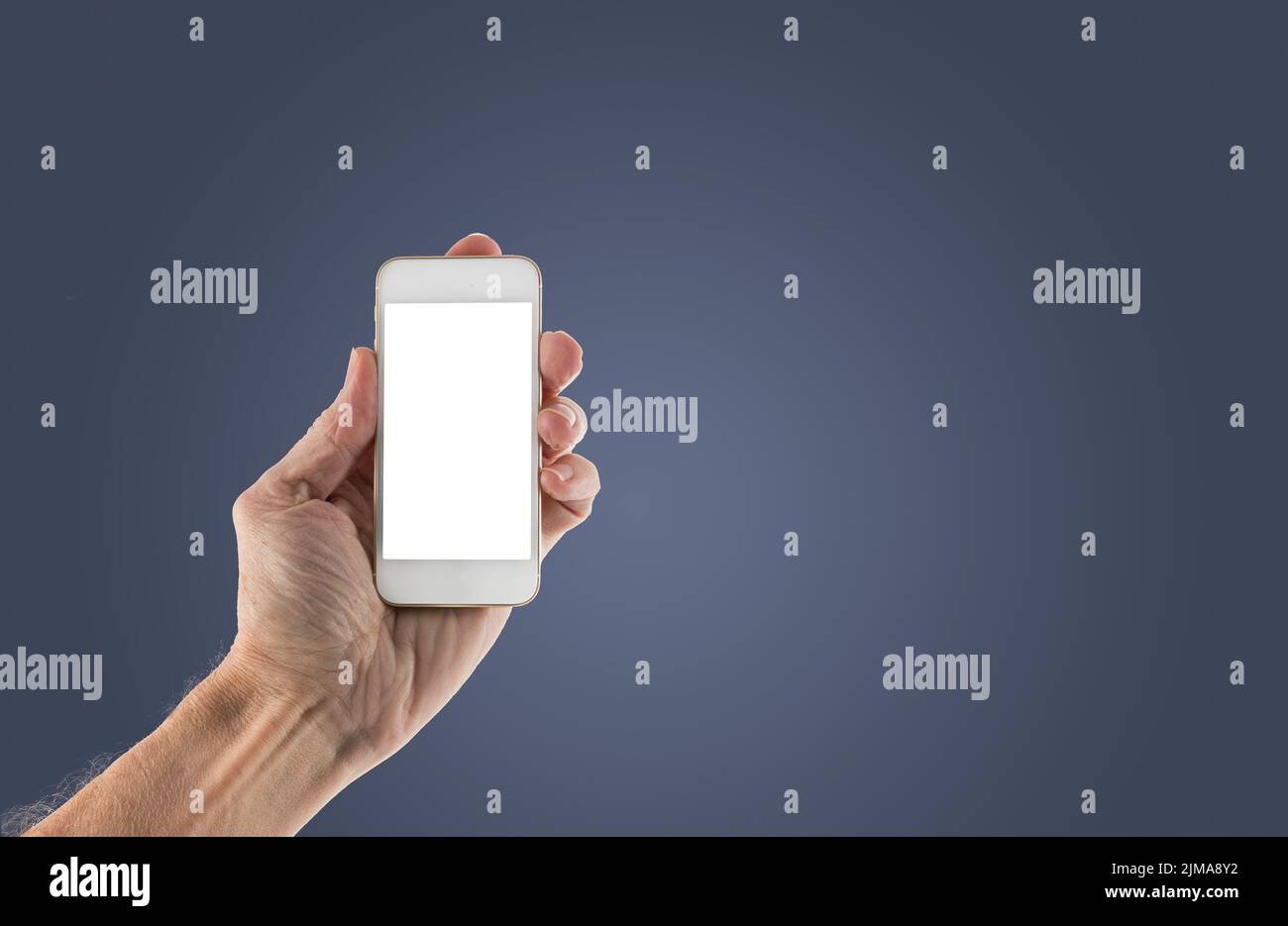 Male left hand holding smartphone with blank screen Stock Photo