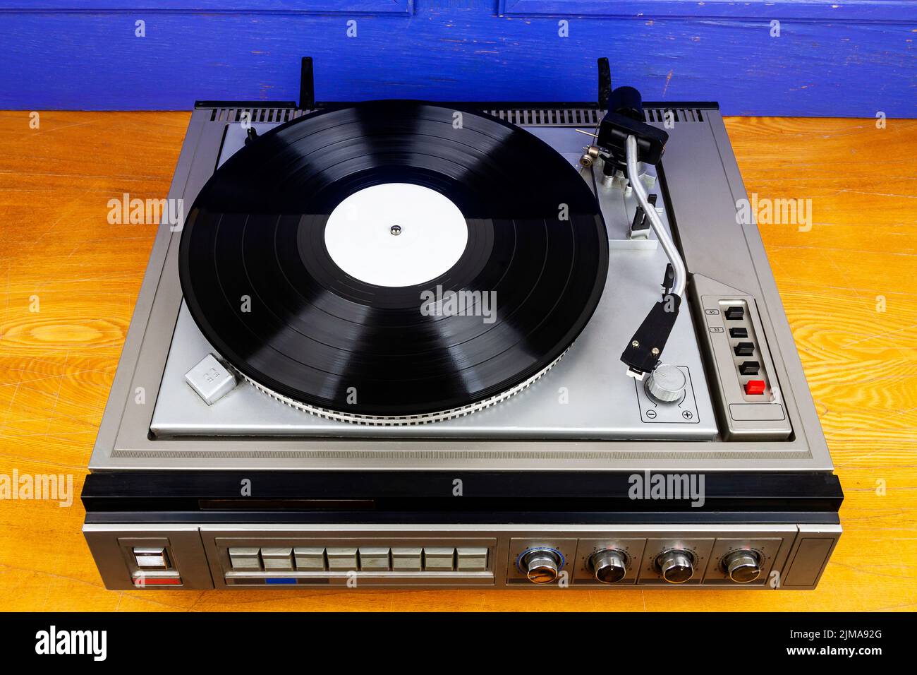 Vintage turntable vinyl record player with black vinyl on a table Stock ...
