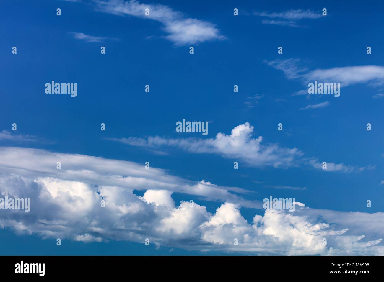 Sky background with dark blue skies and white clouds Stock Photo
