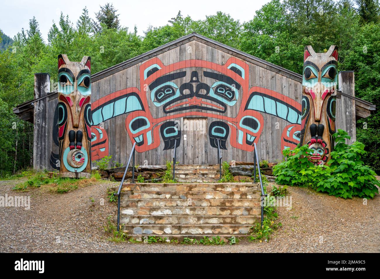 Saxman, Alaska - July 29, 2022: Tlinget totem poles, long house and traditional art. Stock Photo