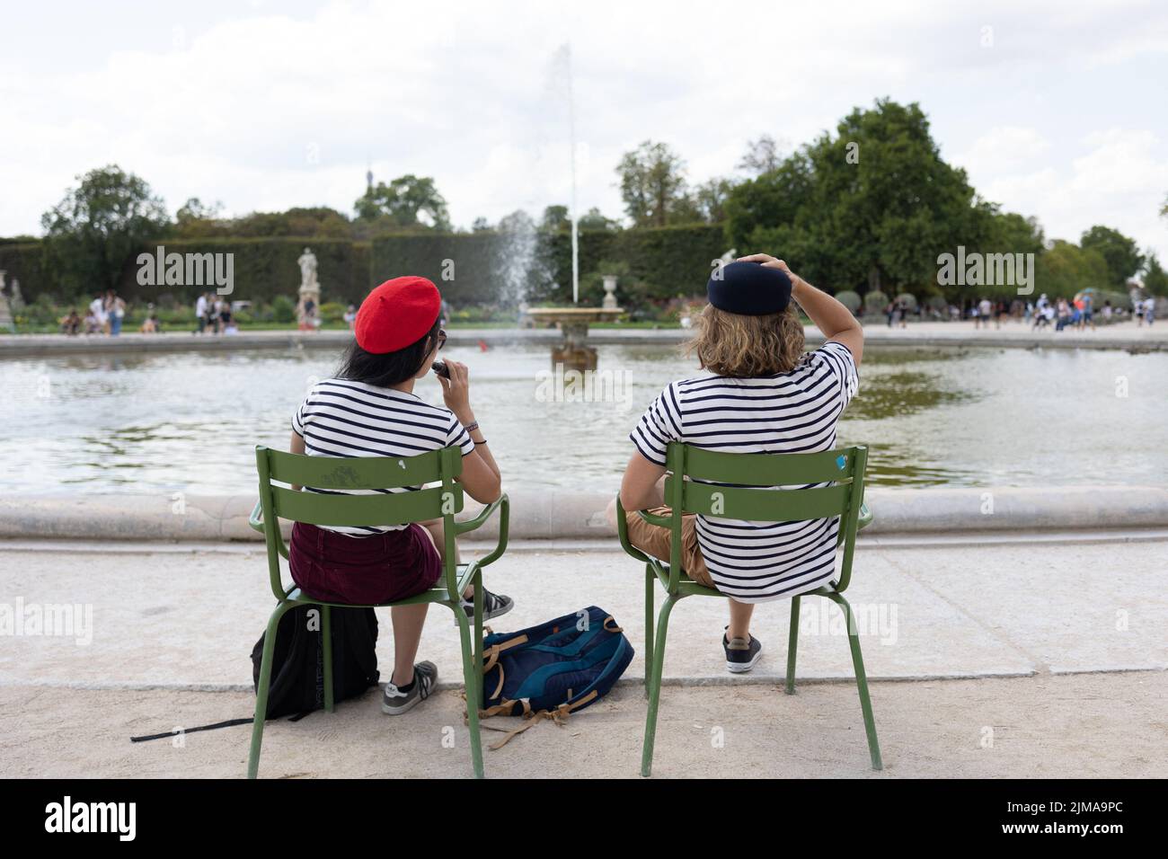 Tourists wear a Beret and sailor shirt in the tuileries garden in Paris on August 4, 2022. Since the US Dollar has a higher value than the Euro, many american tourists visit the French capital. Photo by Raphael Lafargue/ABACAPRESS.COM Stock Photo