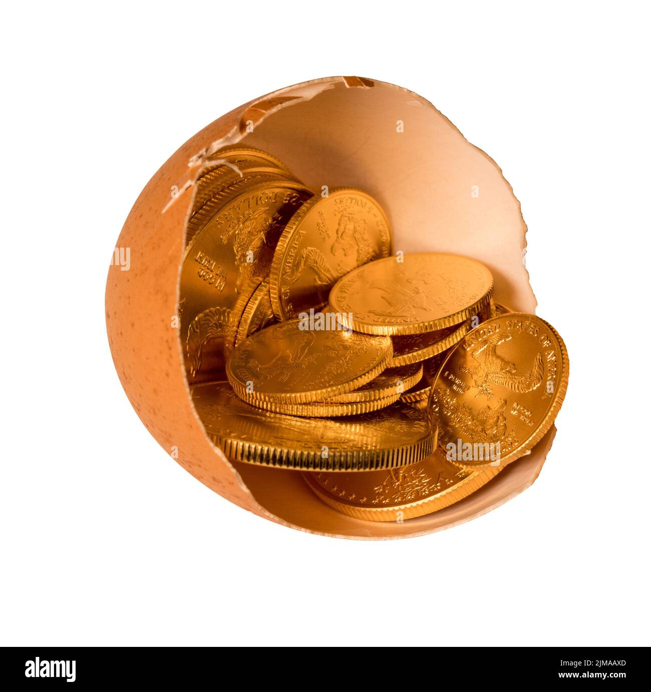 Pure gold coins in egg shell illustrating savings Stock Photo