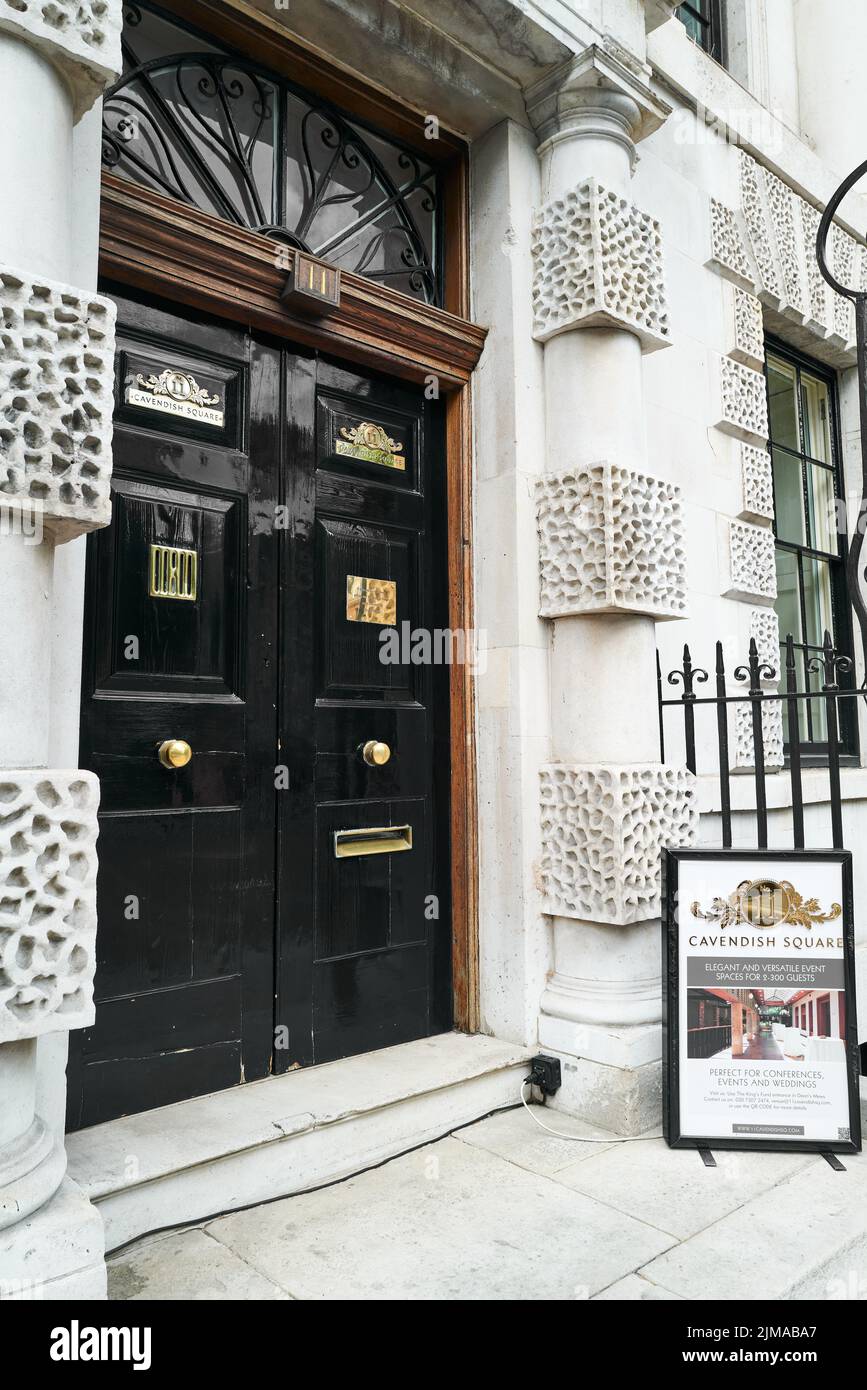 Entrance door to the King's Fund (president, HRH Prince of Wales) headquarters at the former convent school, Cavendish Square, London, England. Stock Photo