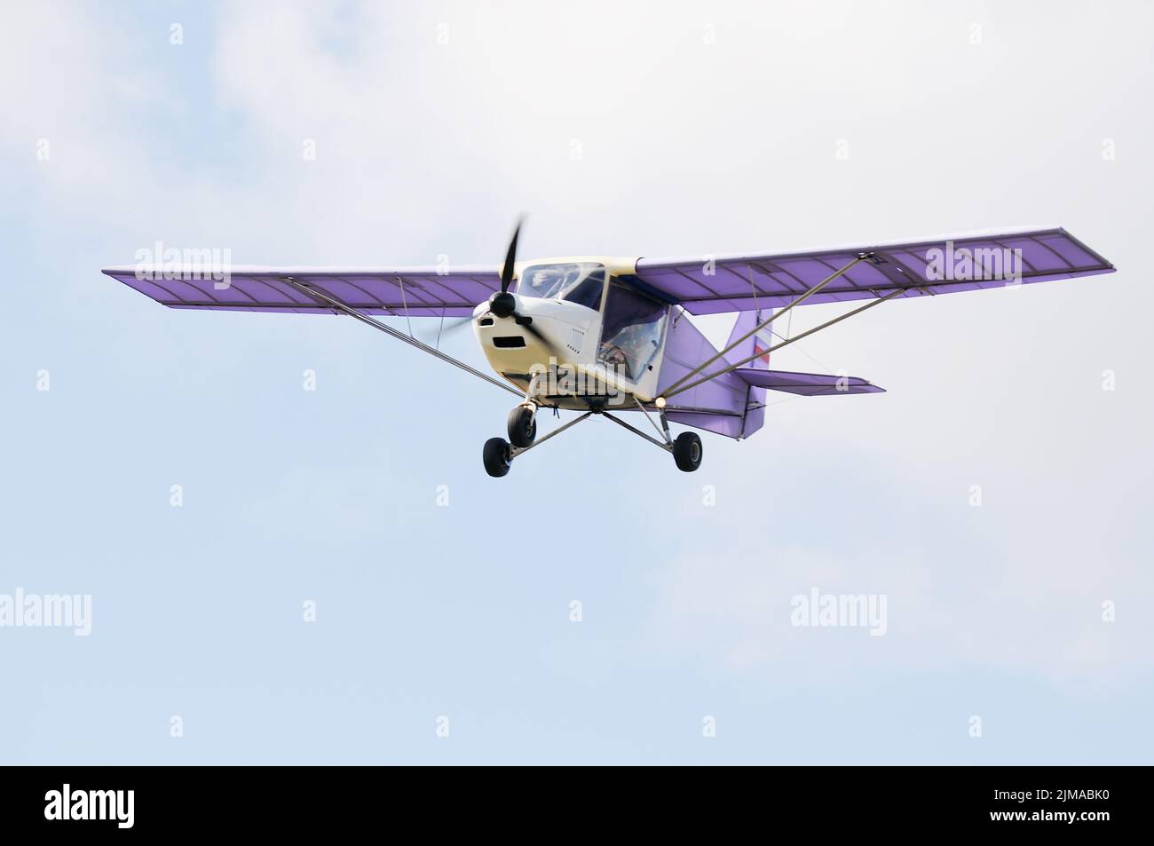 Private propeller-driven airplane flying in cloud sky Stock Photo - Alamy