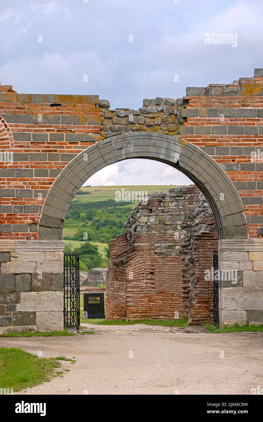 Gamzigrad, Serbia - June 11, 2022: Entrance Arch Gate to Felix Romuliana UNESCO World Heritage Site From Roman Period. Stock Photo