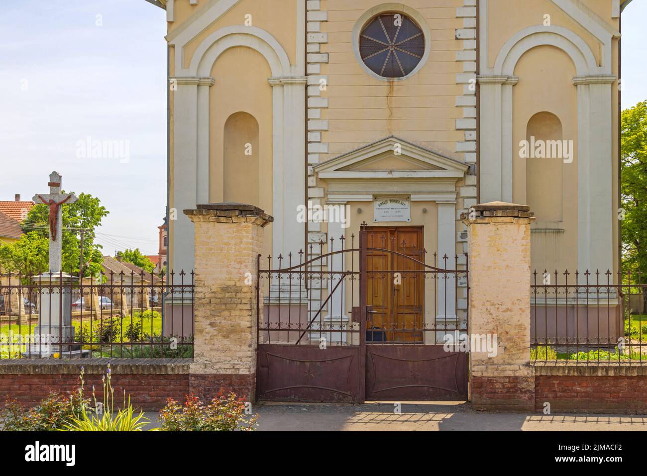Golubinci, Serbia - May 08, 2022: Entrance to Roman Catholic Church of Saint George at Djurdjevska Street. Stock Photo