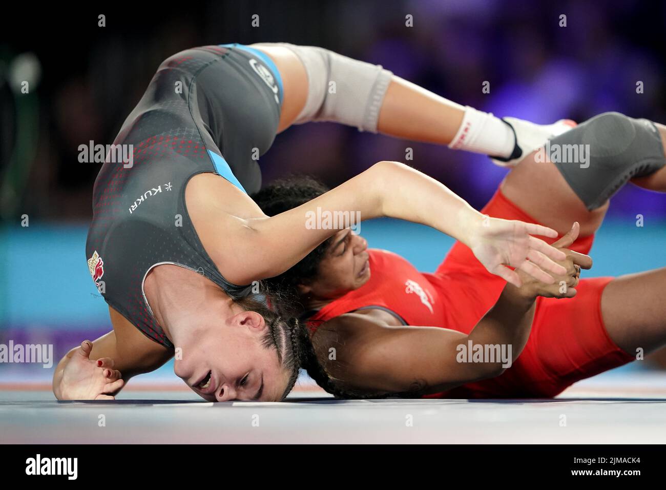 England's Kelsey Barnes grapples with India's Sakshi Malik during the