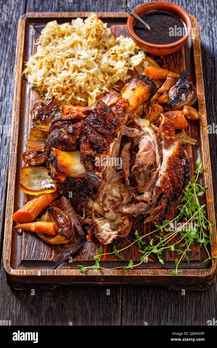 Crispy German Pork Knuckle, roast ham hock, Schweinshaxe, with Beer Gravy, Sauerkraut and roast